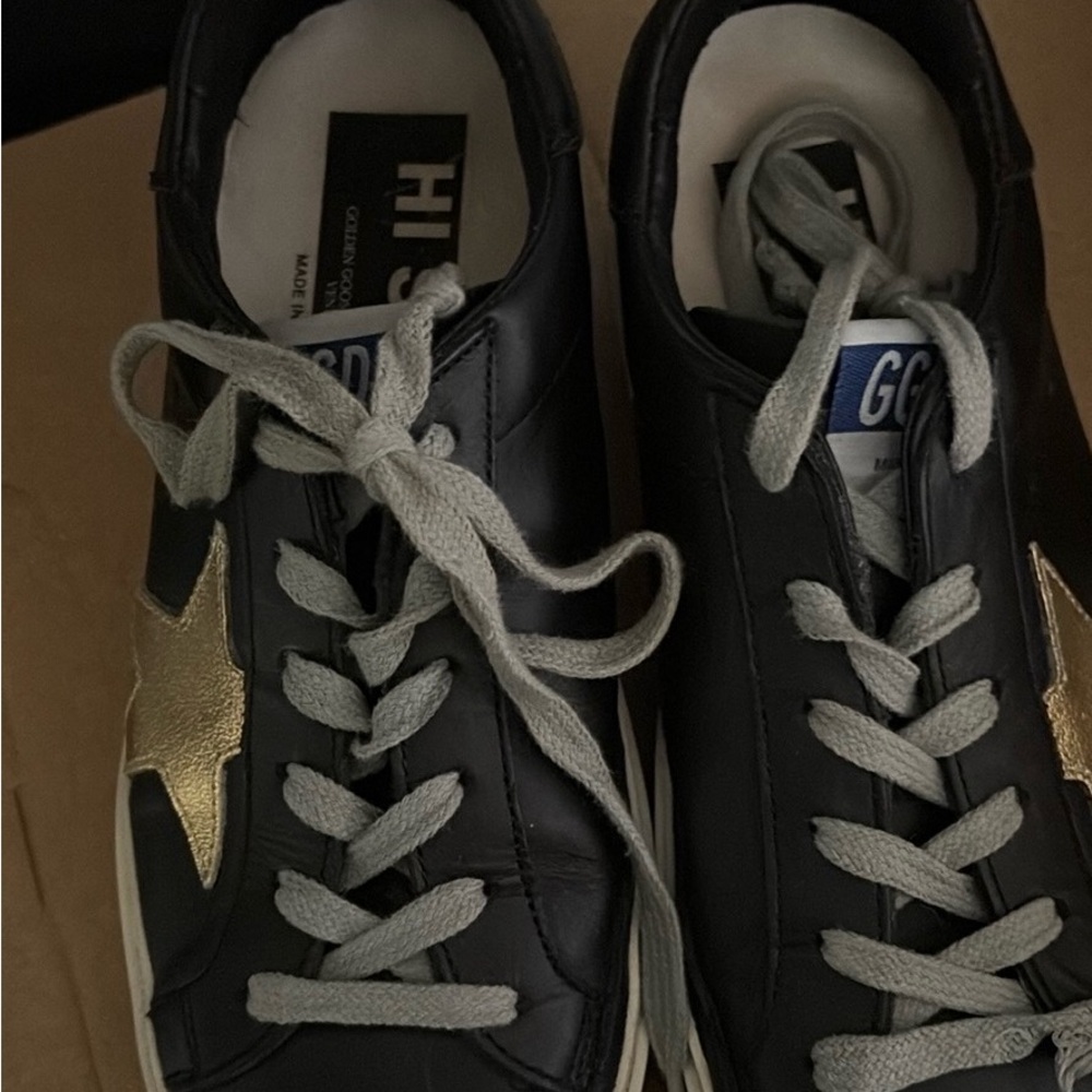 Black Sneakers with Gold Star Accent